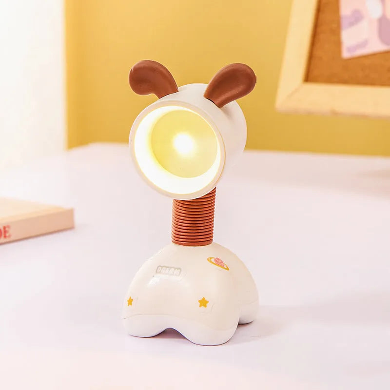 Cartoon animal magnetic night lamp with adjustable head on metallic surface