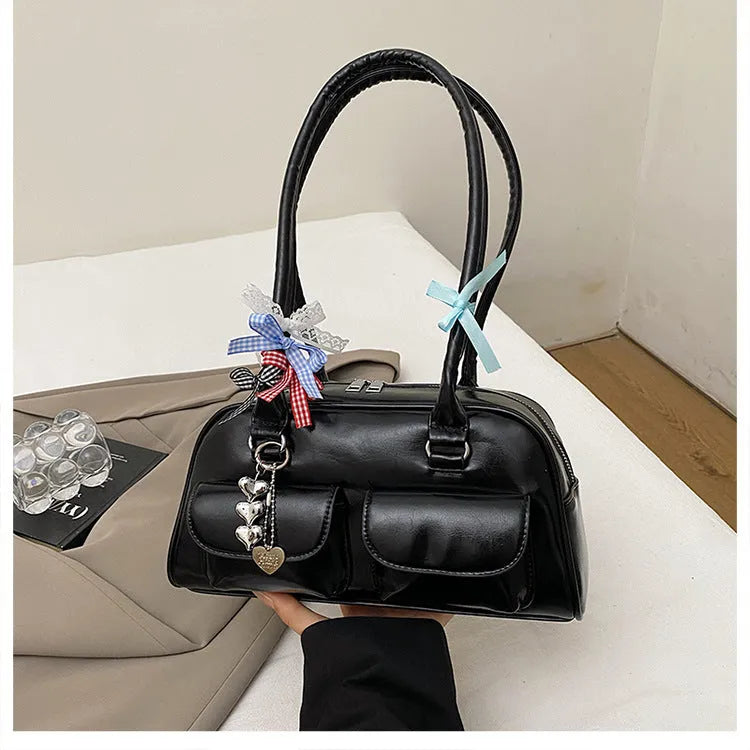 Retro brown PU leather pillow-shaped women's handbag with a flap and double shoulder strap