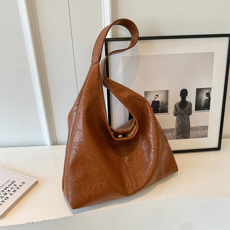 Casual soft leather shoulder bag with large capacity and sandwich pocket in street trend style