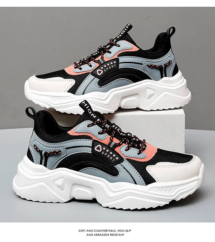 Women's white thick-soled casual sports shoes with mesh upper, round toe, and buckle closure.