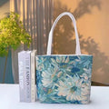 Double-sided gold wire embroidered canvas tote bag showing Bunny design with reinforced base