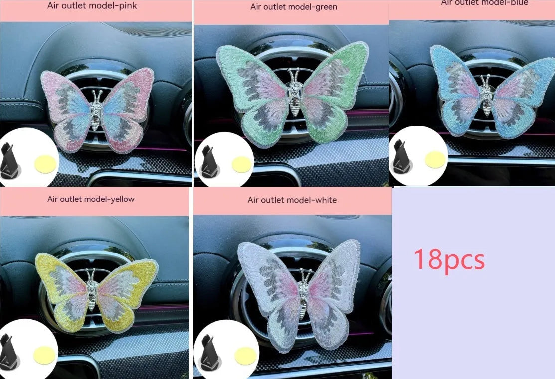 Moving embroidery butterfly decoration on car centre console air vent in pink fabric