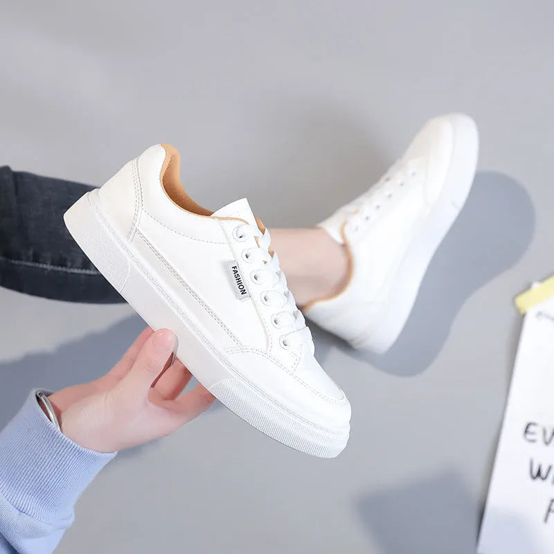 Women's low top sneakers in white or brown with artificial PU upper and plastic sole