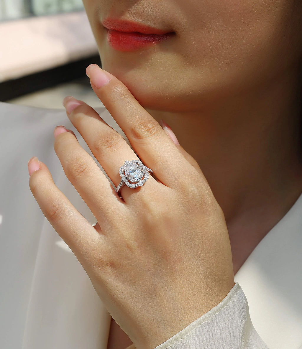 Camellia egg-shaped moissanite wedding ring set with S925 silver and platinum plating, showing centre stone and band