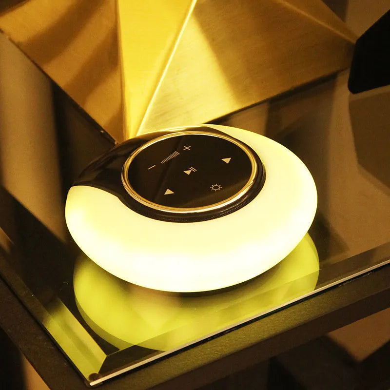 Blue cubic Bluetooth desk lamp with speaker and touch controls for dimming and colour selection