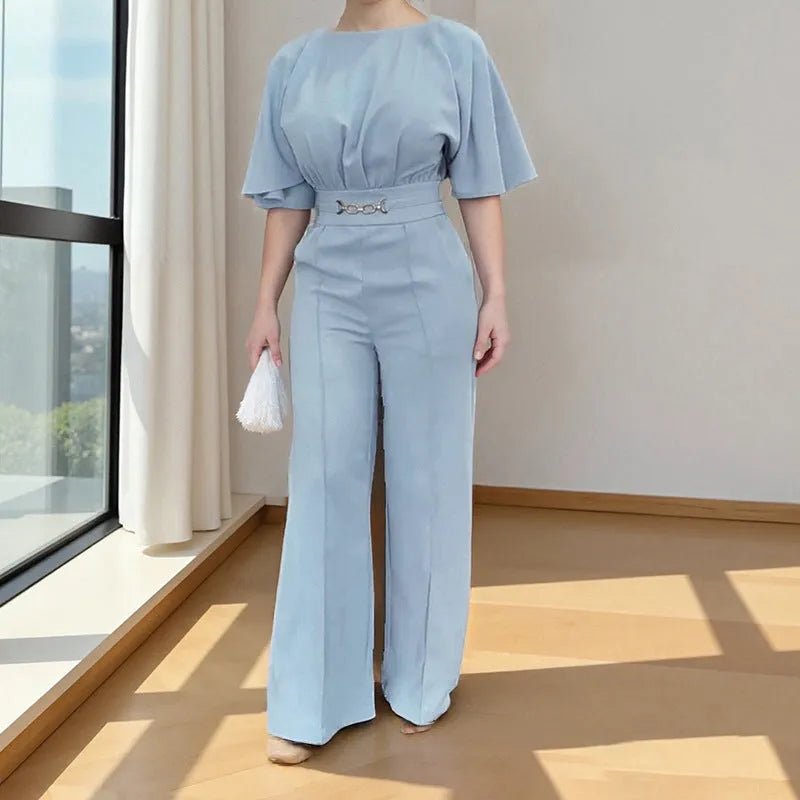 Blue polyester men's suit comprising trousers and a long-sleeve shirt, laid flat.