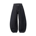 Men's original cow colour wide leg denim trousers laid flat showing mid-waist and relaxed leg cut