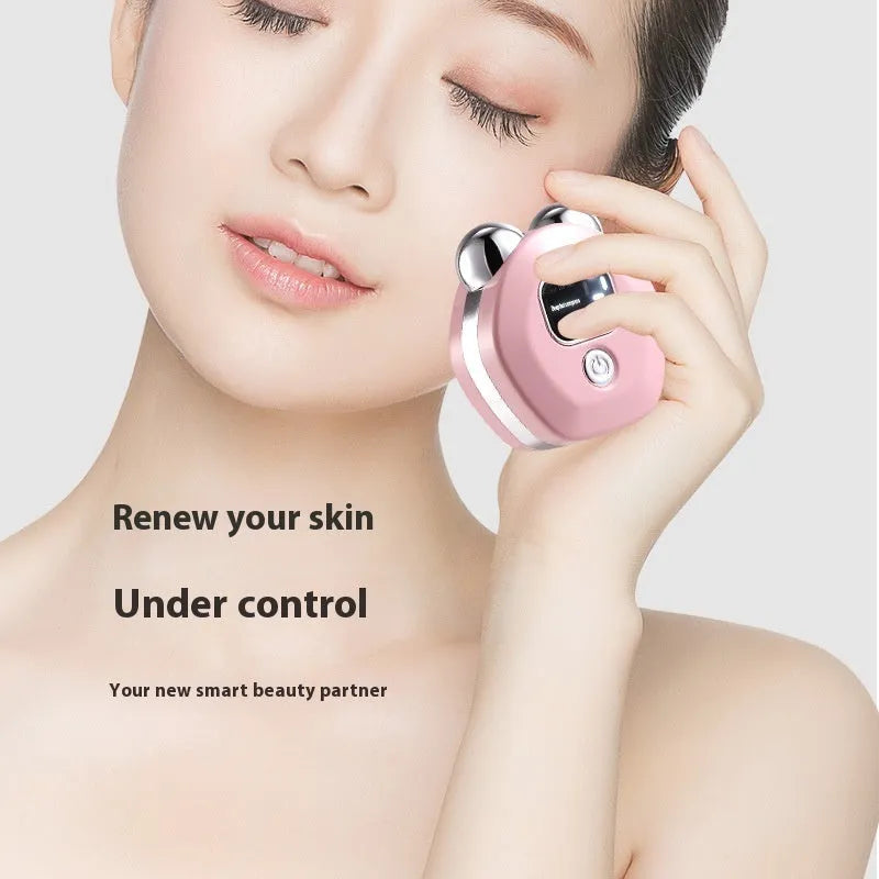 Portable white hot compress microcurrent facial massage instrument with two silver roller heads.