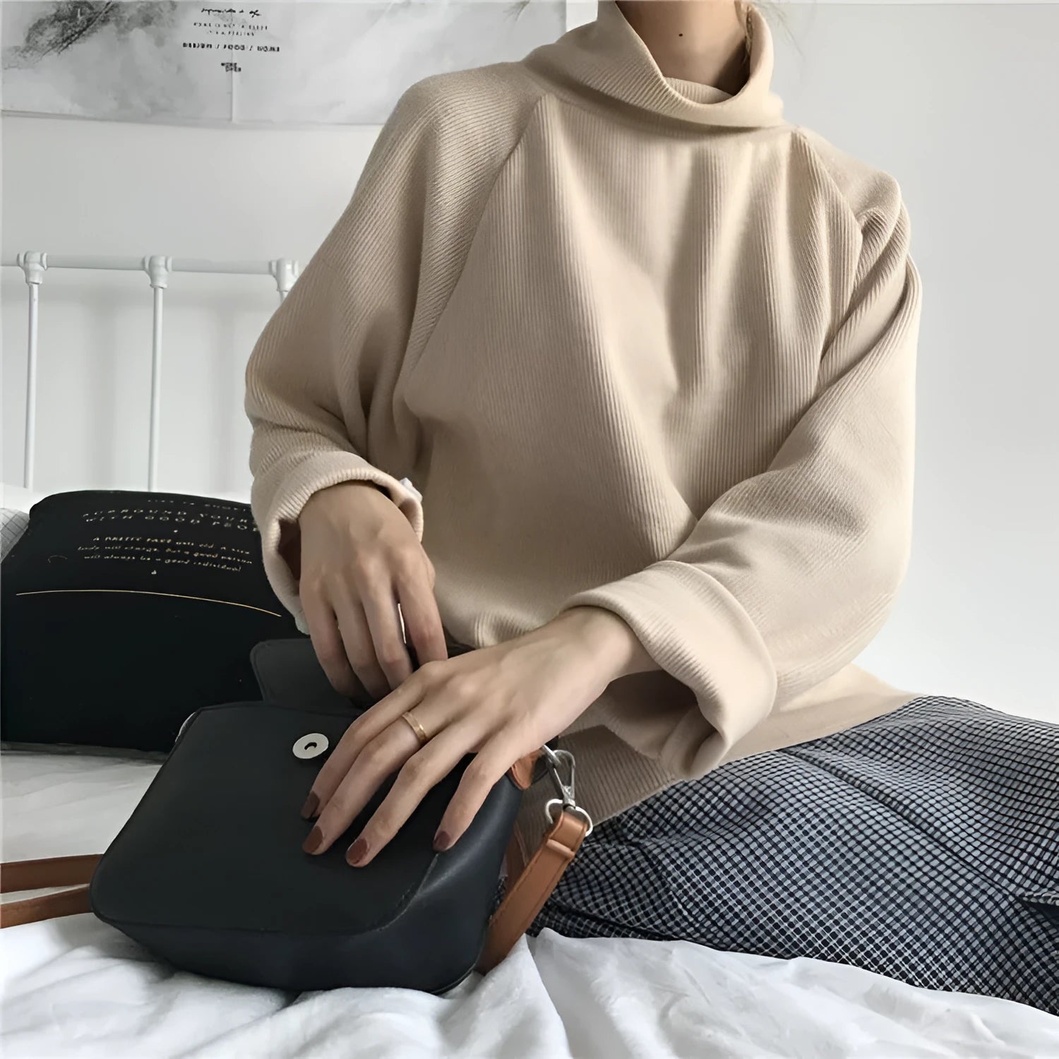 Women's loose-fitting long sleeve top with a half-high collar in a solid colour.
