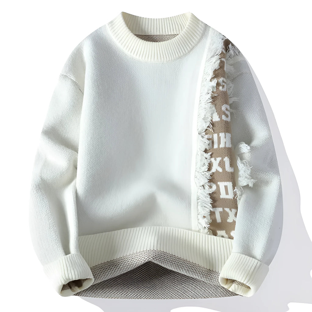 Man wearing a grey loose fit knitted pullover with long sleeves and a ribbed hemline.