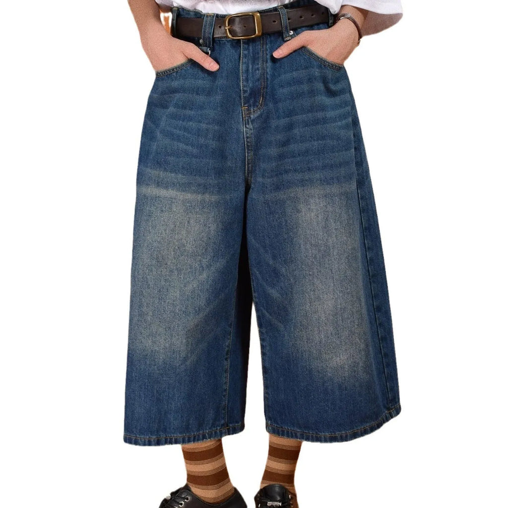 Men's loose straight-leg denim shorts in blue, shown with a fifth pants length for summer.