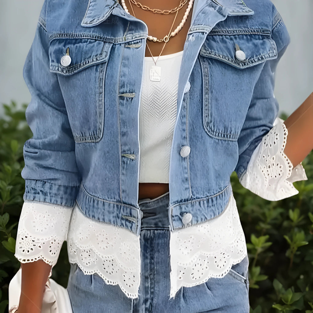 Blue women's denim jacket with decorative lace stitching on the front and sleeves.