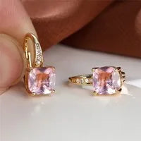 Square geometric ear hook studs with a round zircon stone, shown in a gold electroplated finish.