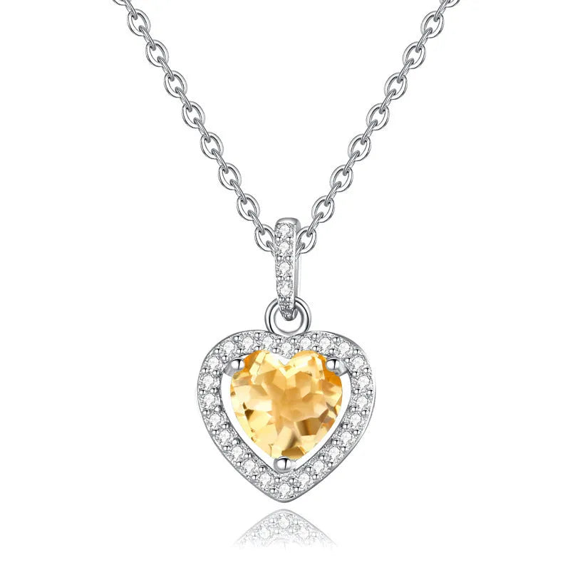 Sterling silver heart pendant necklace with a natural coloured gemstone on an adjustable cross chain.