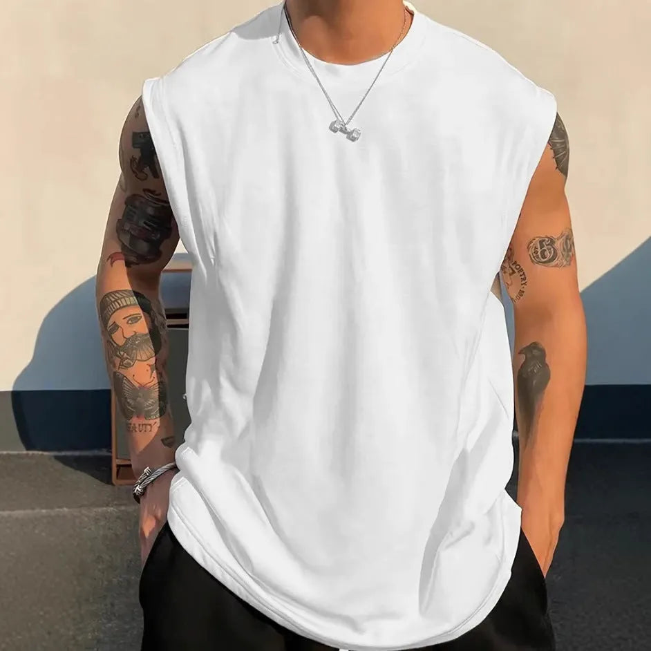 Men's loose fit sleeveless cotton tank top in solid colour on a hanger