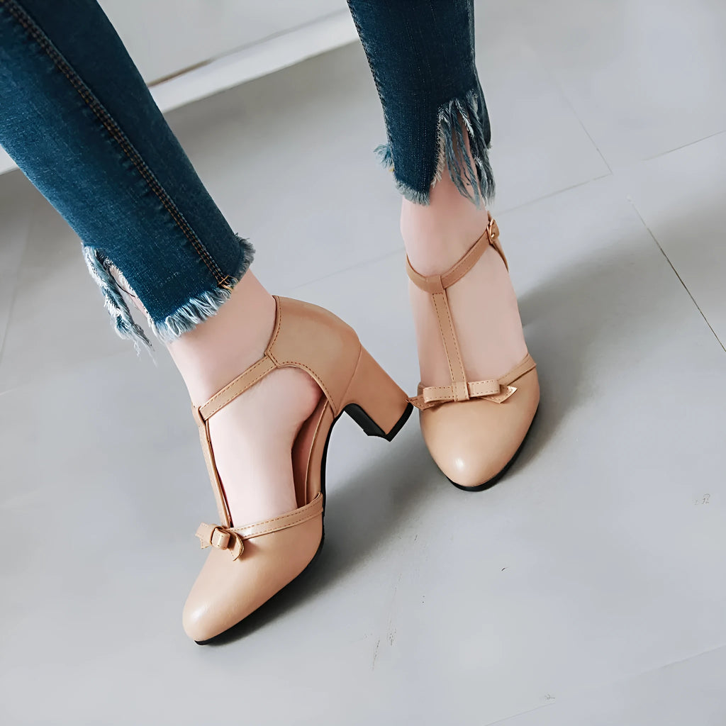 Women's chunky heel sandals with hollow-out design and decorative bow in solid colour with buckle strap