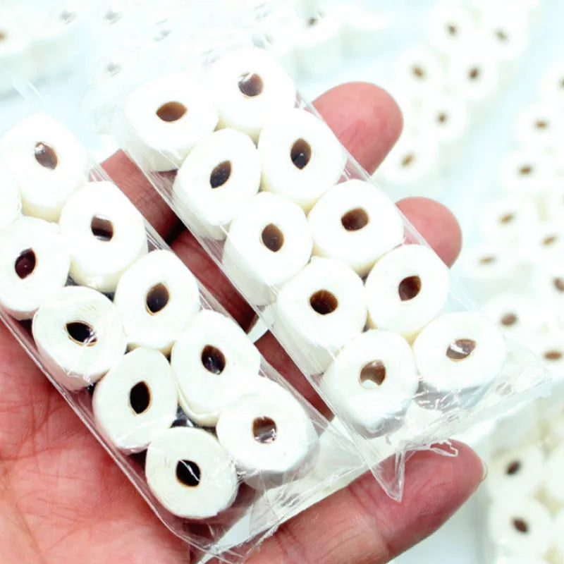 Small white simulated toilet paper roll model for children's educational toy play.