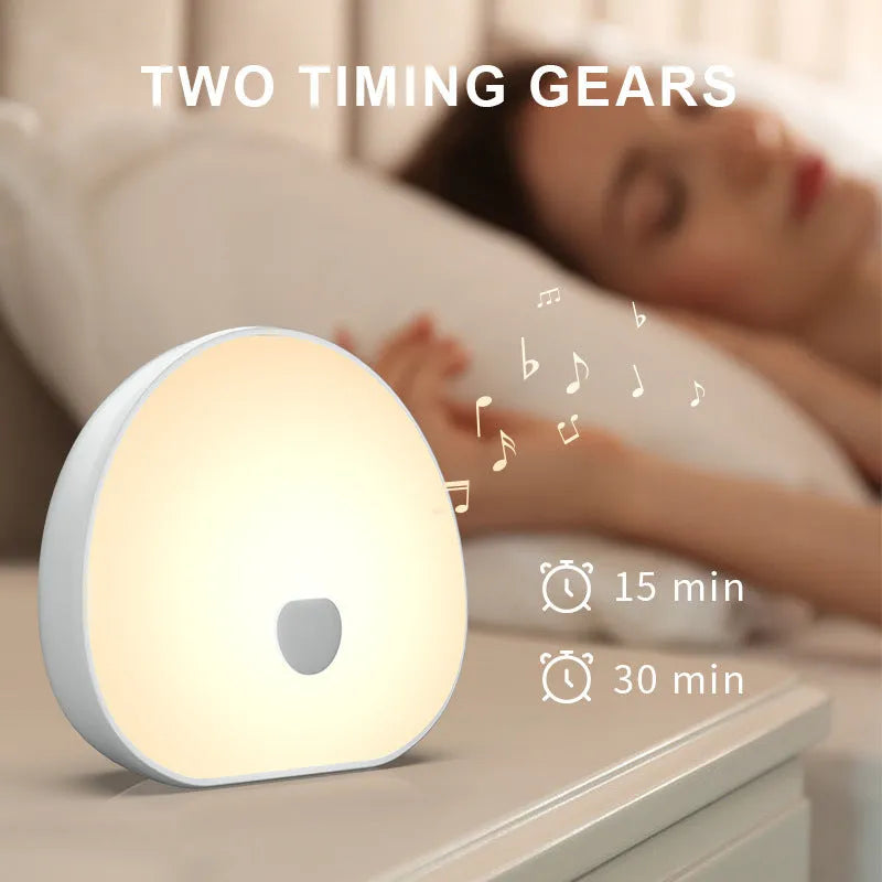 White rechargeable baby feeding comforter with music function for night feeding sessions