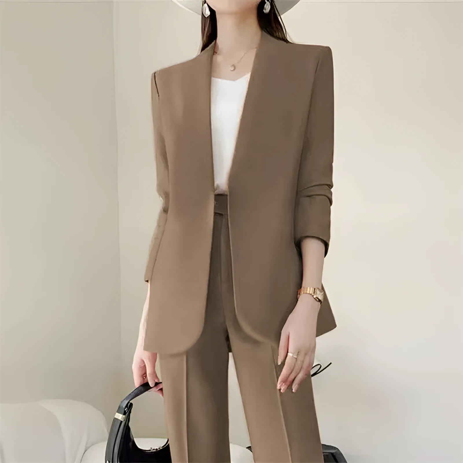 Women's polyester business suit set with blazer and trousers in beige, model standing