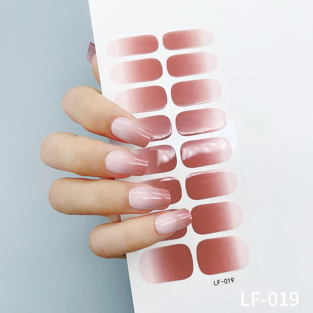 Set of 16 solid colour full nail art stickers showing patterns like cross, rose, tulip, and cartoon designs.