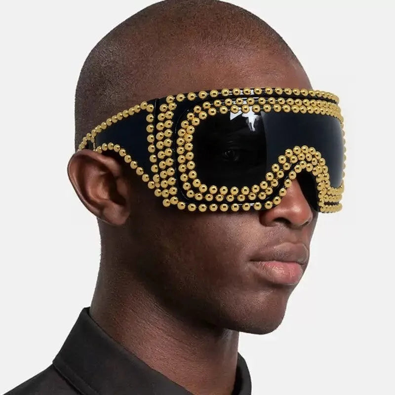 Men's punk sunglasses with large rim and square rivet details in gold colour