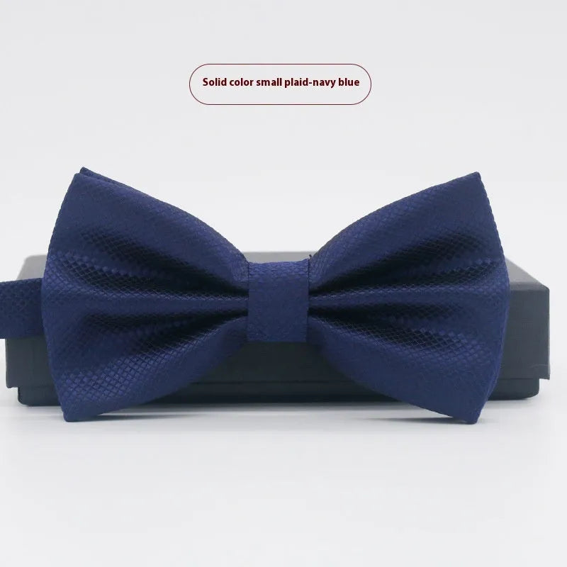 Solid colour polyester bow tie with flat head design measuring 12cm by 6cm
