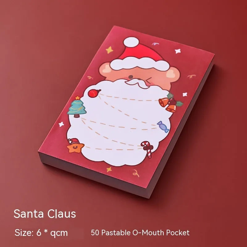 Christmas sticky notes pad with festive designs including elf, gift, sled, Santa Claus, bear, and snowman