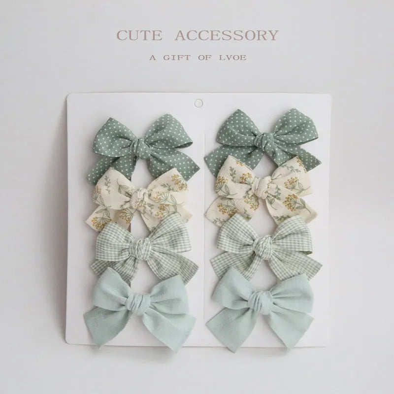 Children's cloth hairclips with dovetail bow decoration in multiple colour options