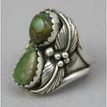 Turquoise geometric retro ring for women on a white background, showing inlaid design.