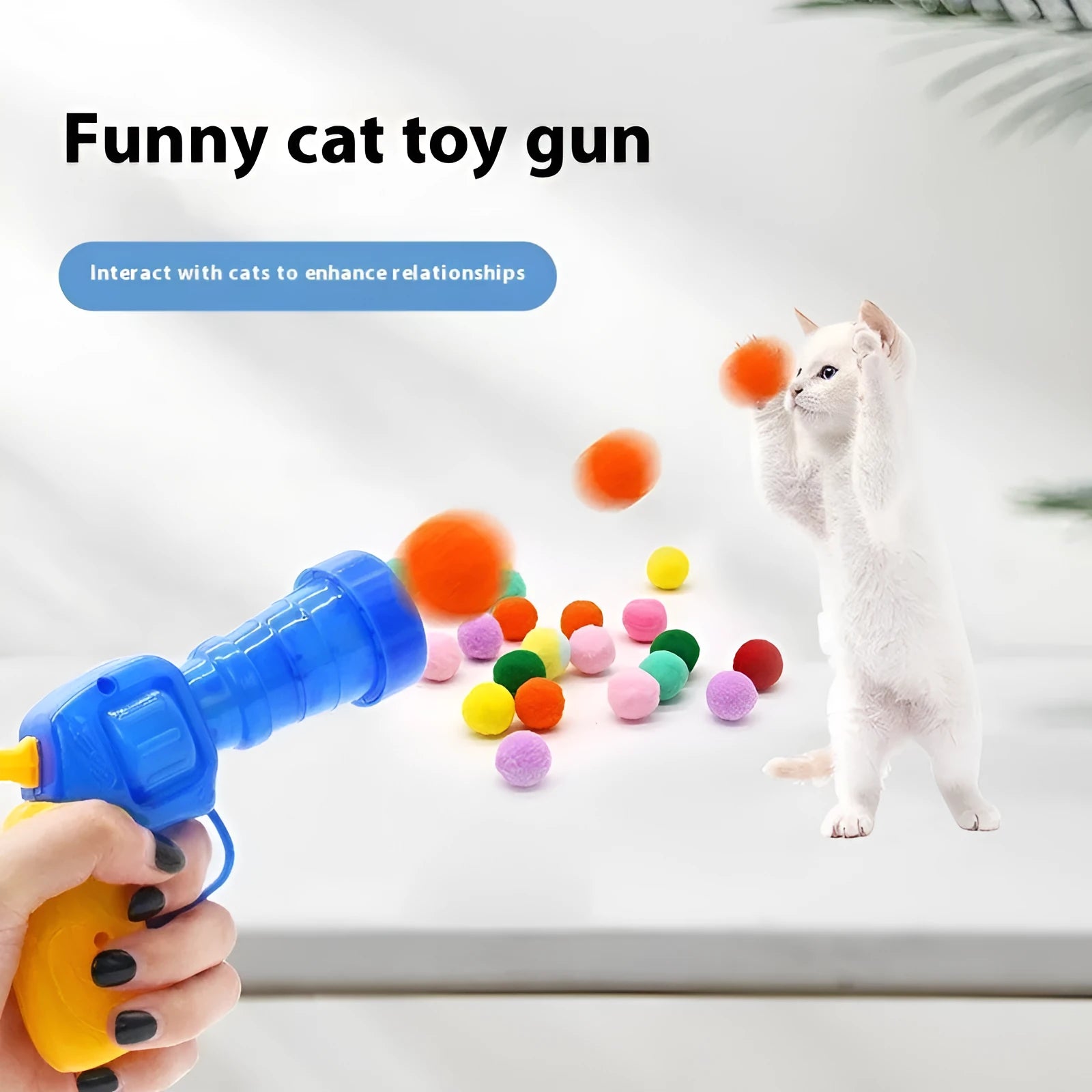 Plush pet launch gun with soft yarn balls for interactive cat and dog play sessions