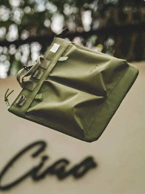 Marden Tooling medium canvas messenger bag in charcoal black with a shoulder strap and hard handle.