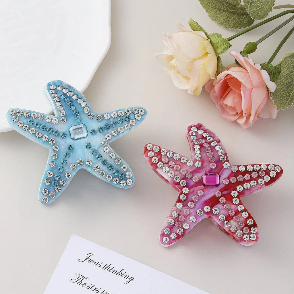 Acrylic starfish hairpin with diamond encrusted surface in blue colour, 8cm length