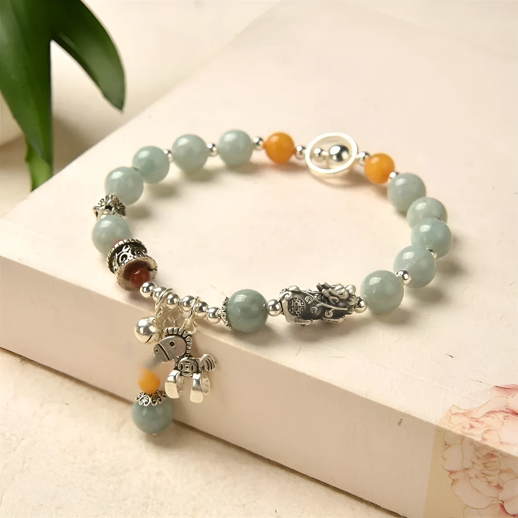 Natural emerald green jade vintage pony style bracelet with an alloy clasp.