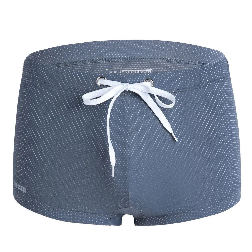 Men's low-waist boxer style swimming trunks with lace detailing in nylon fabric