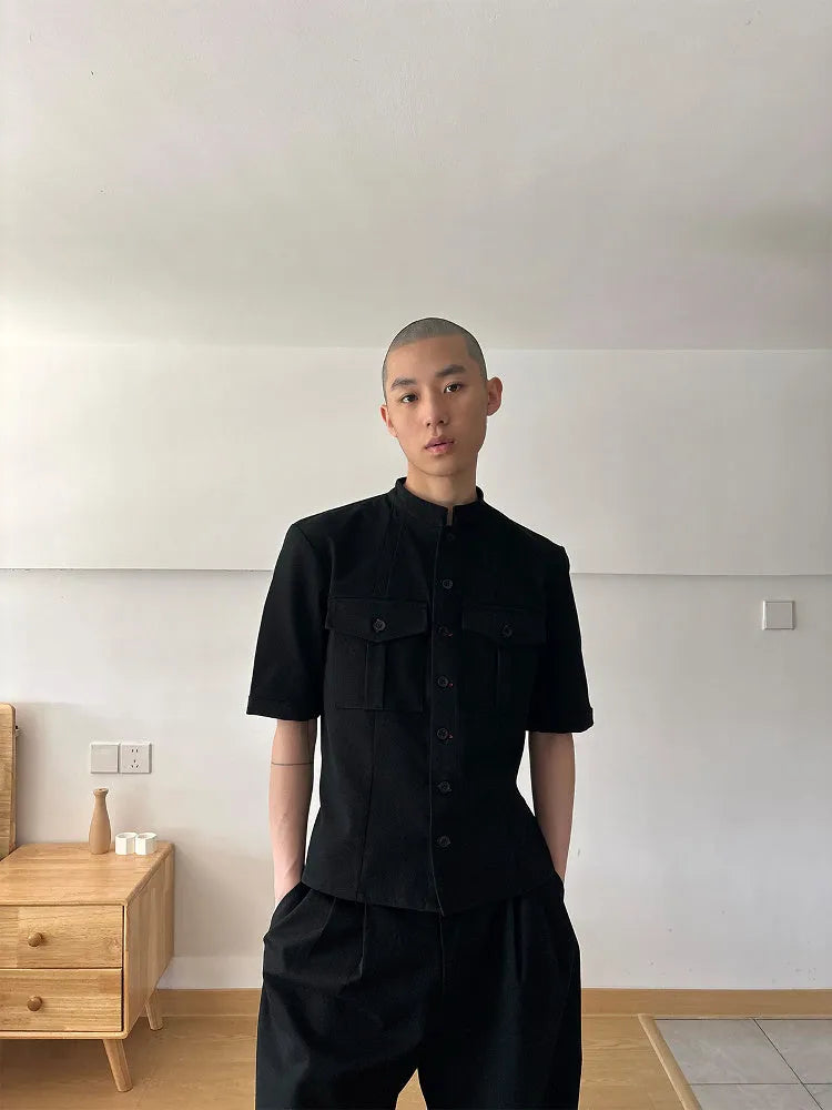 Black loose fit hunting shirt with half sleeves, shirt collar, and single-breasted placket