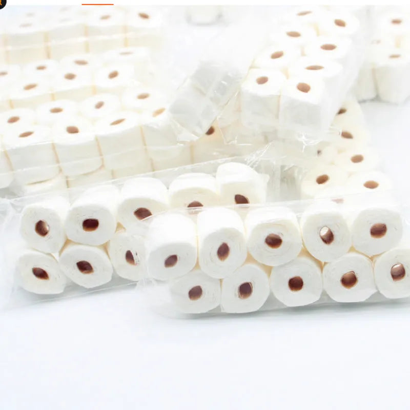 Small white simulated toilet paper roll model for children's educational toy play.