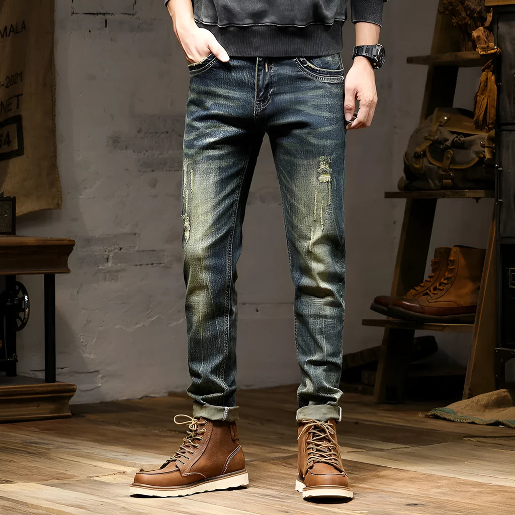 Men's skinny-fit jeans in a retro blue colour with a zip fly, shown laid flat.