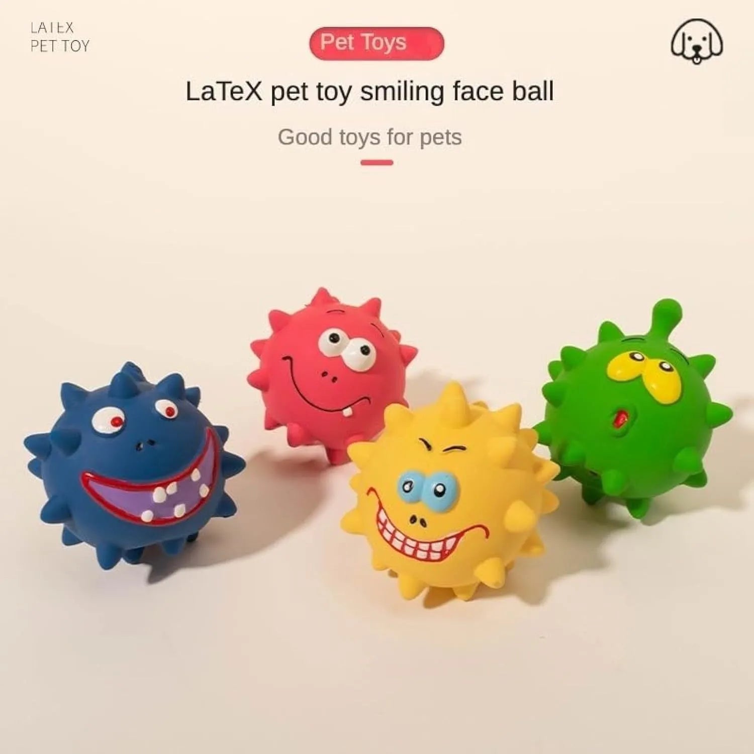 Set of four colourful latex squeaky dog balls with cute faces on bumpy textured surfaces