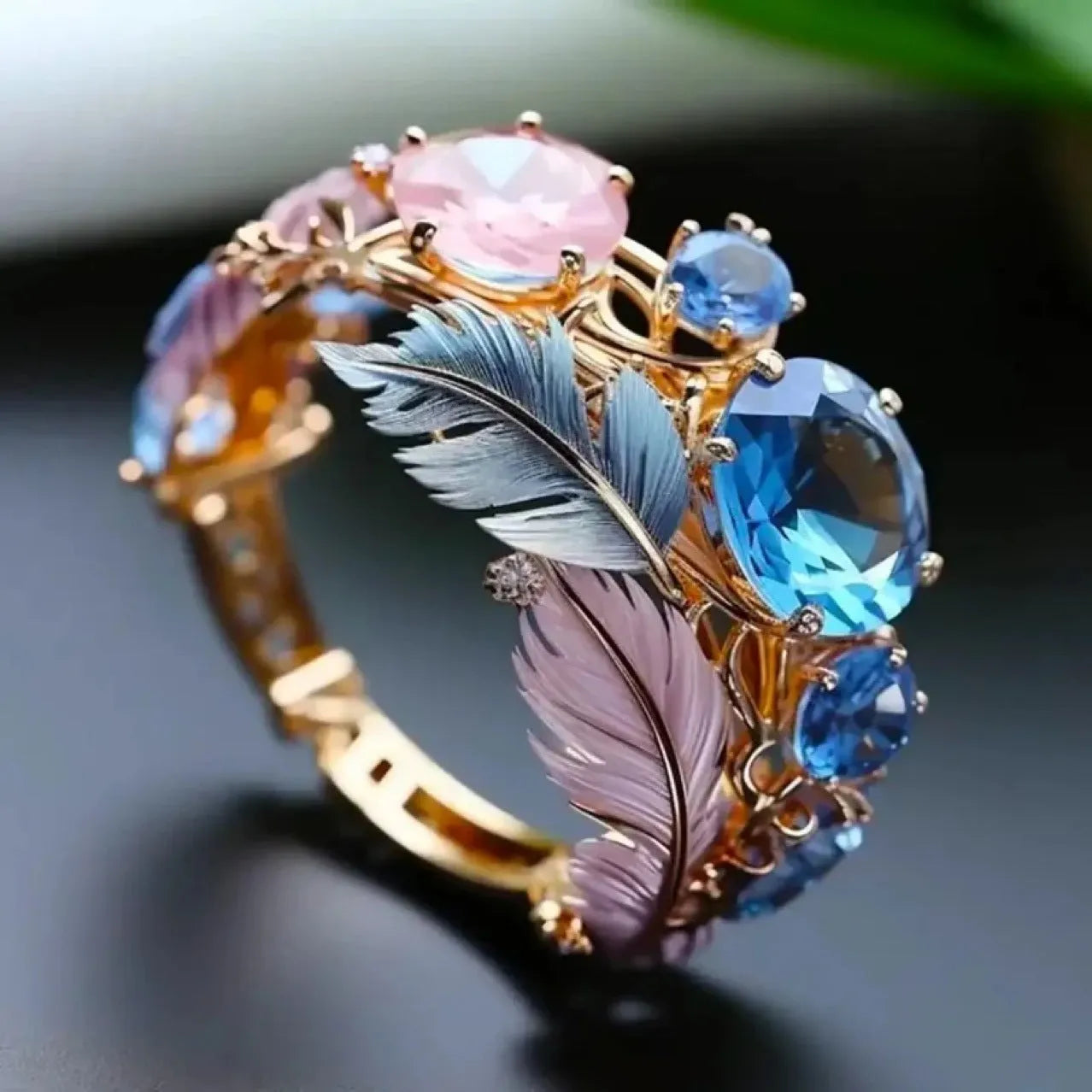 Brass feather ring with embossed design and zircon stones in geometric gold colour