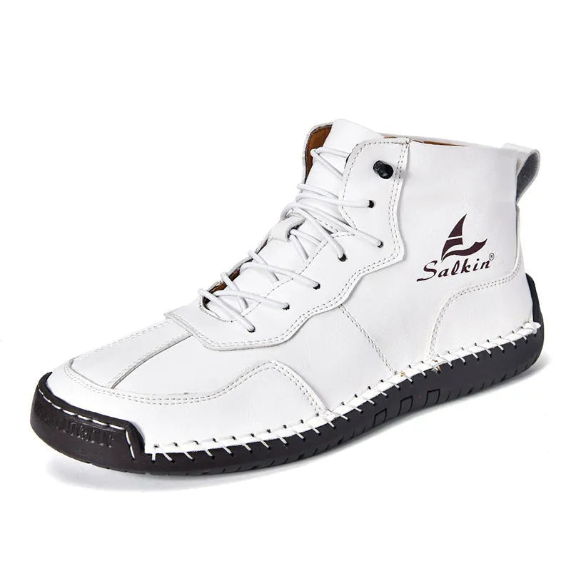 Casual high-top leather boots with elastic band closure and flat heel in beige colour with visible sewing detailing