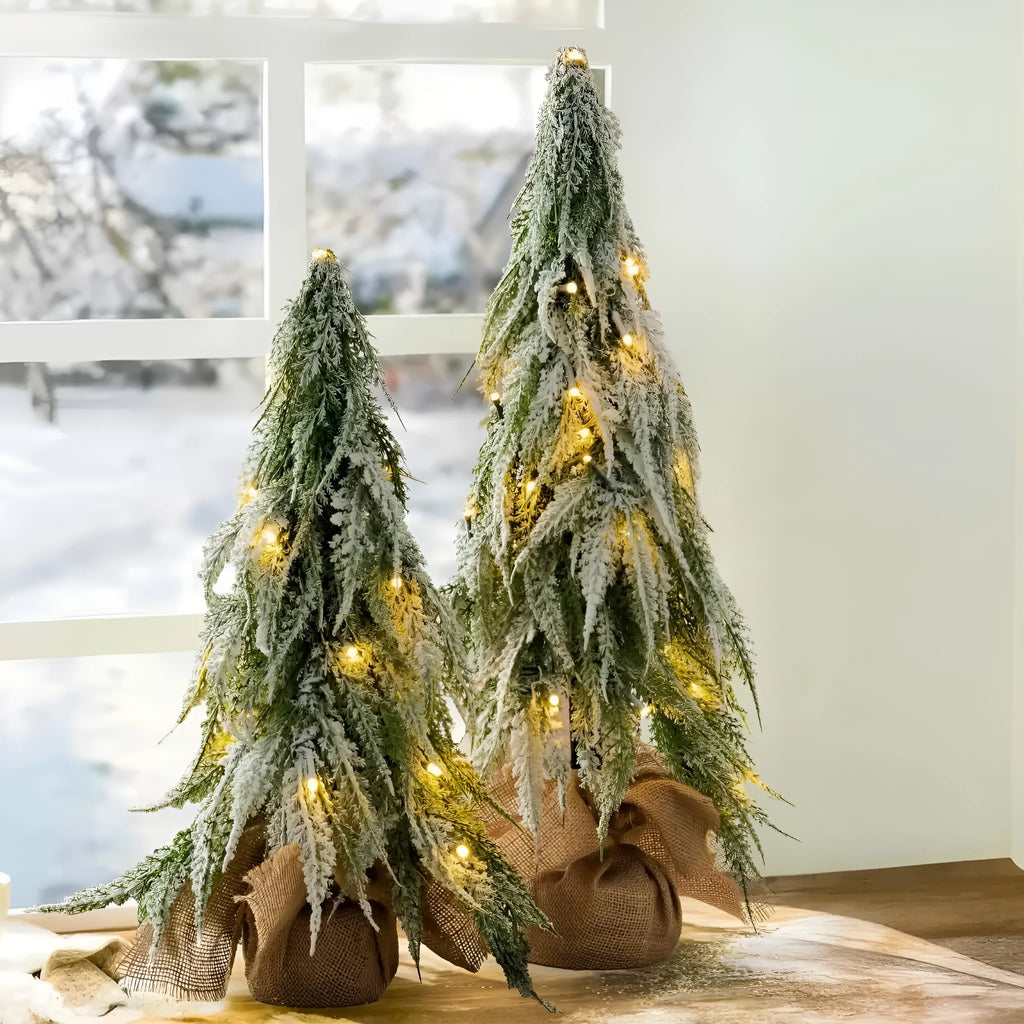 Small 24-inch white Christmas tree with lights and snow-covered branches for desktop decoration