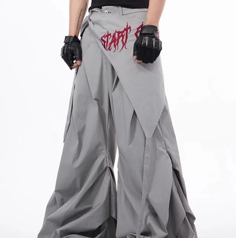 Boy modelling black wide-leg Korean-style summer pants on a casual backdrop.