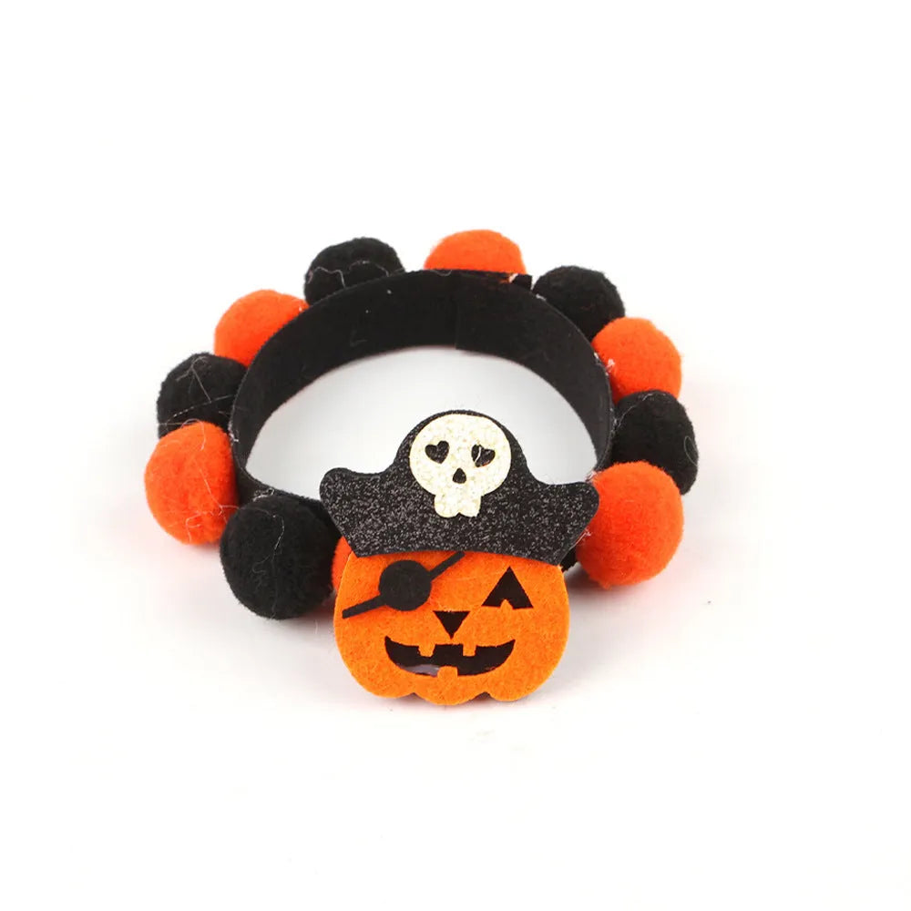 Halloween pet fur ball collar accessory for small dogs and cats in pumpkin, skull, and witch designs.