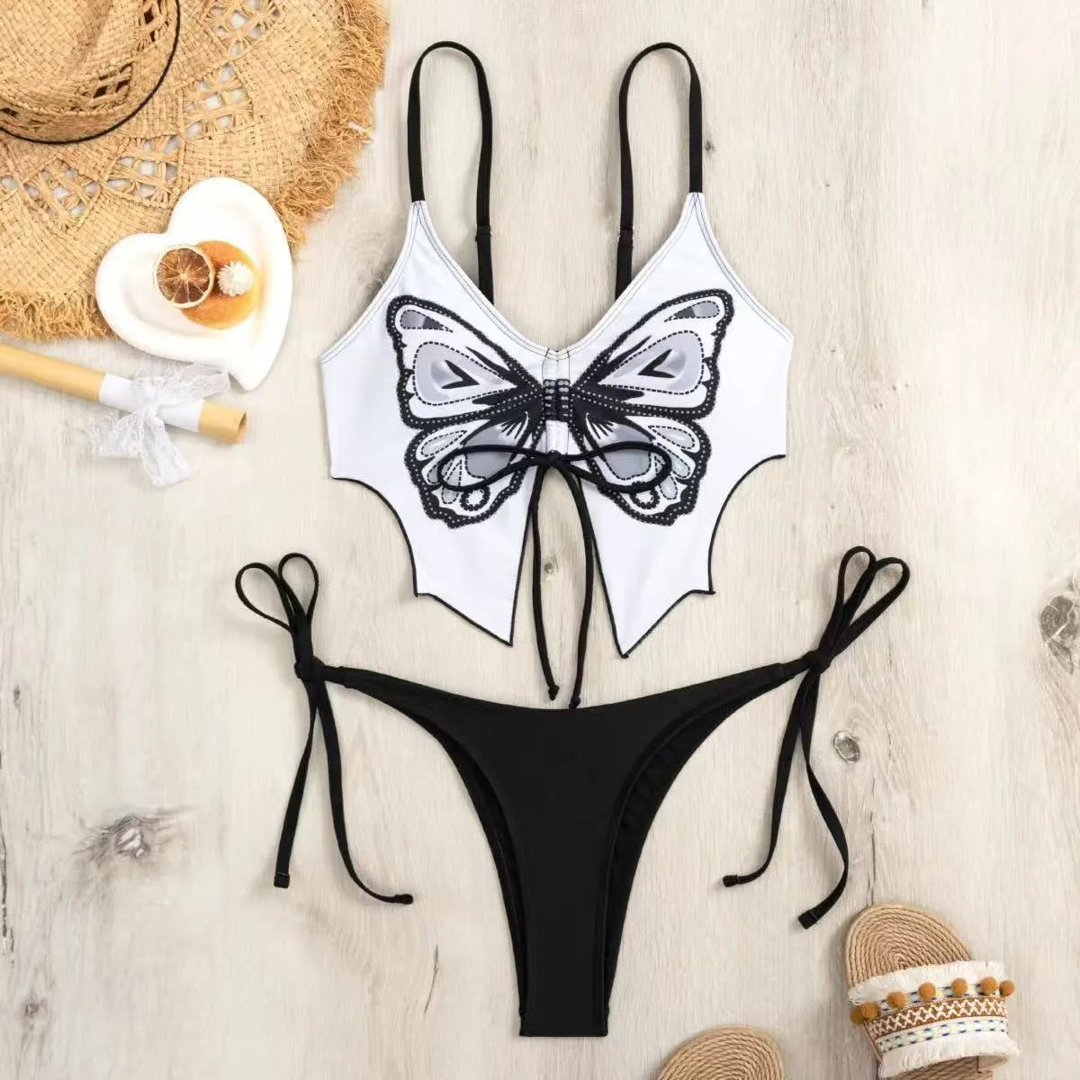 Women's purple bow ins style split bikini set with sleeveless top and briefs for swimming.