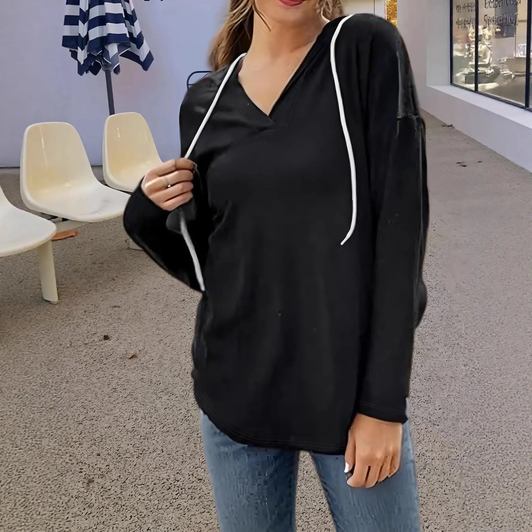 Red women's v-neck hooded sweatshirt with long sleeves on a hanger, loose fit.