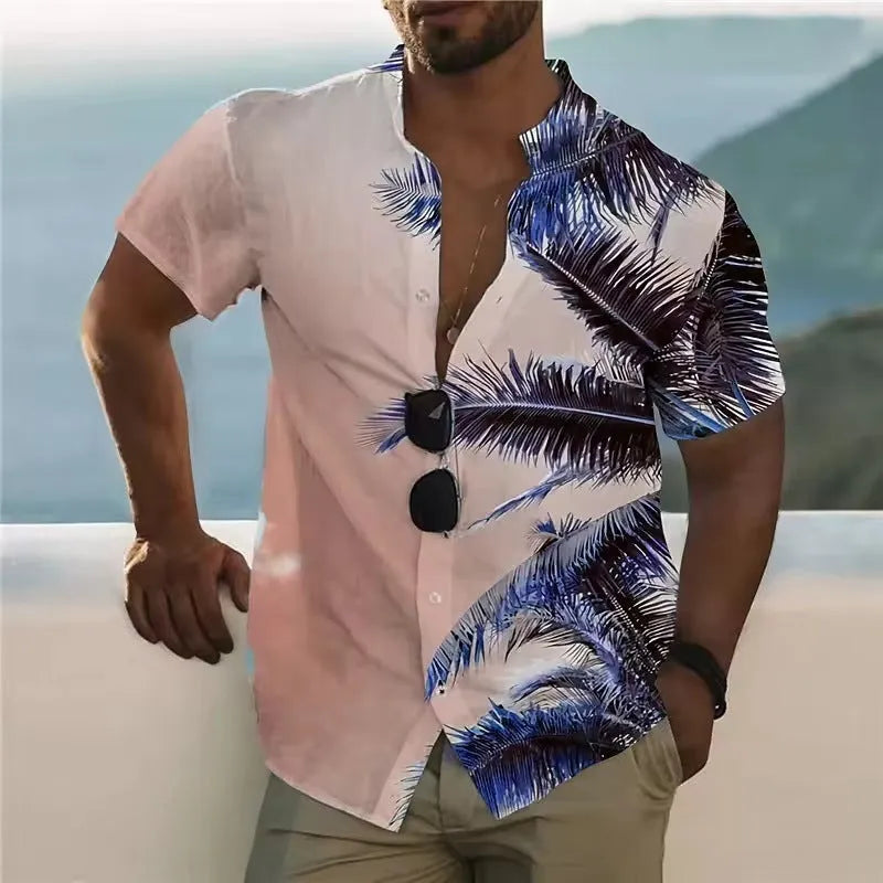 Man wearing a loose-fit short sleeve shirt with a colourful digital flower print pattern.