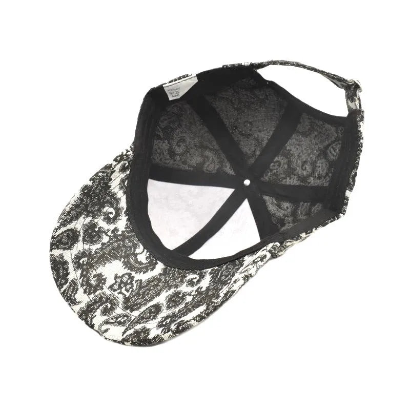 Polyester baseball cap with paisley pattern print in black colour showing dome crown design