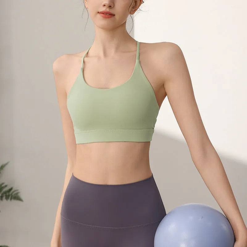 Women's nylon sports vest with fixed double shoulder straps in multiple colours on a size chart