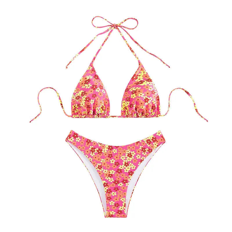 Women's blue printed swimsuit with lace-up front and split shorts on white background