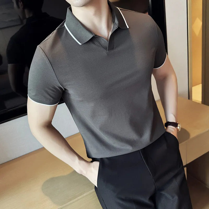 Mens solid colour lapel polo shirt in a cotton blend fabric on a hanger